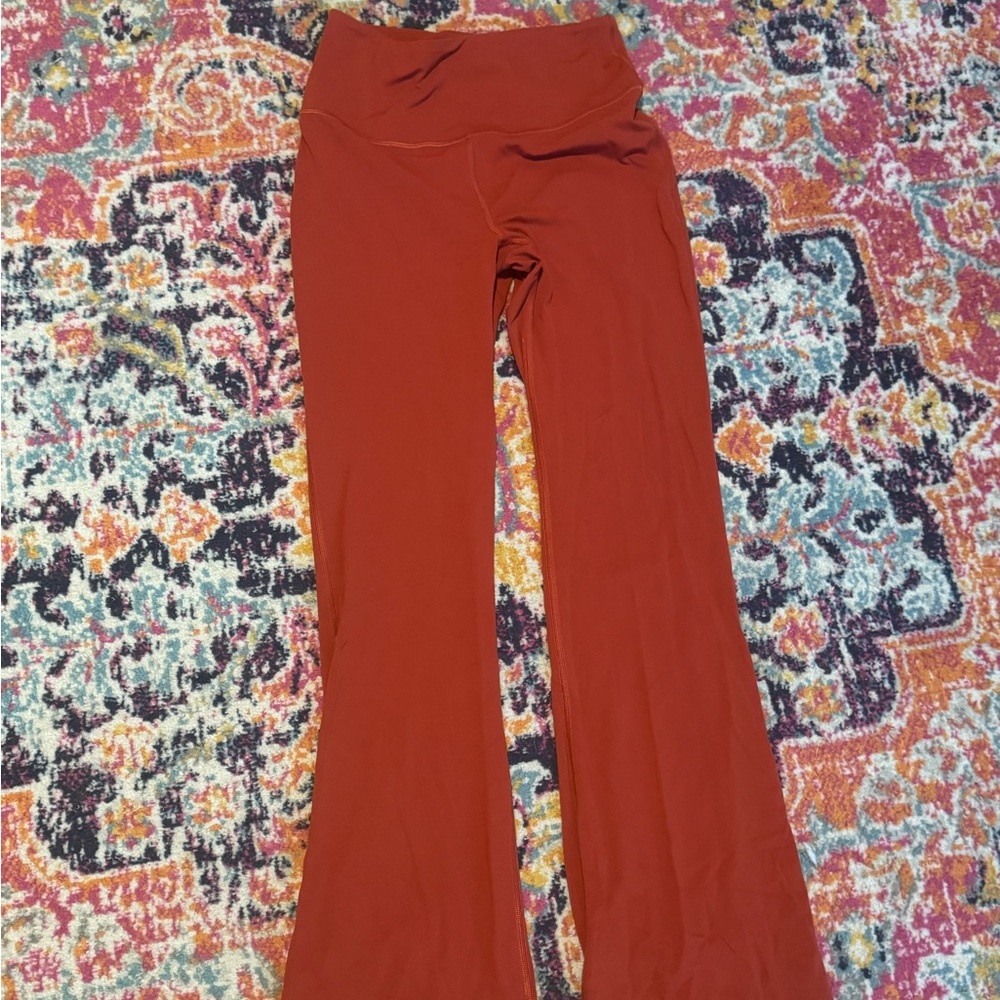 Brand new lululemon flare burnt orange leggings. Size 10 perfect condition